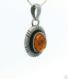 Small Vintage Sterling Silver Pendant with Baltic Amber Cabochon