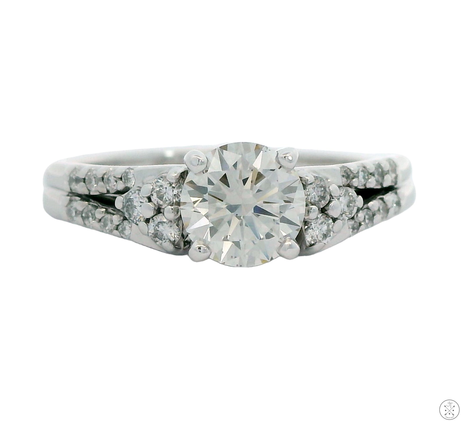 A 14k white gold engagement ring featuring a lab grown diamond center stone with smaller diamonds in the guard, size 9.25.