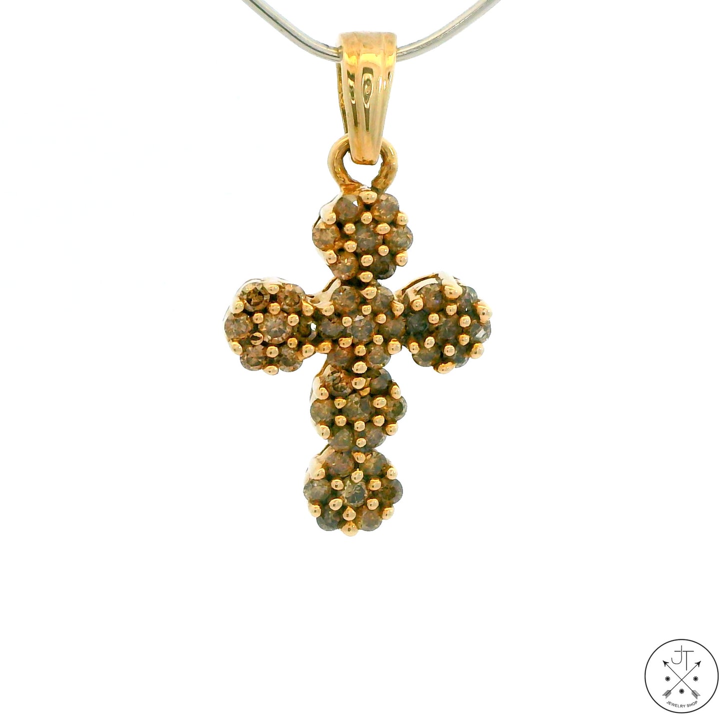 A 10k yellow gold cross pendant with diamond accents on a white background.