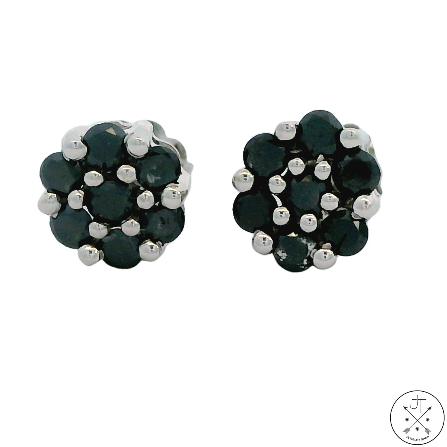 A pair of 10k white gold stud earrings with 1/3 ctw black diamonds, featuring a floral design.