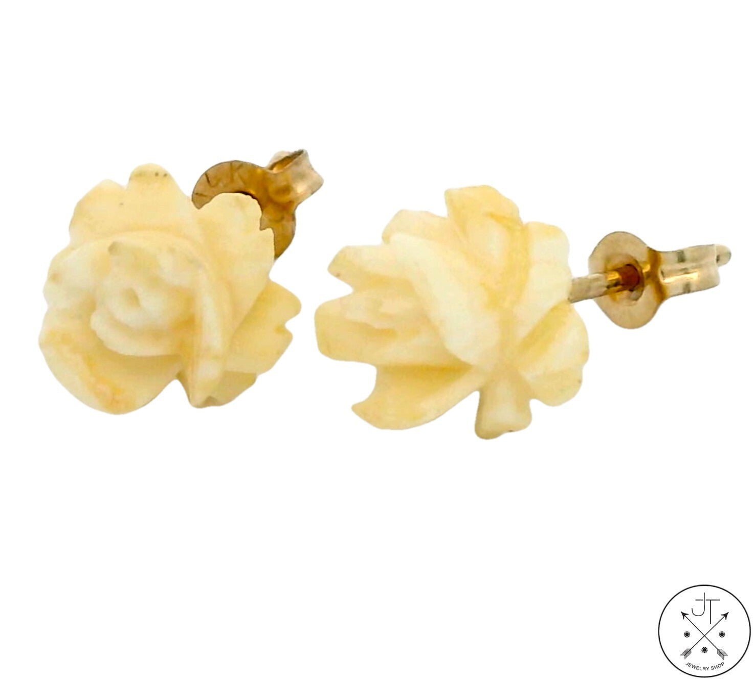 A pair of vintage 14k yellow gold stud earrings with hand-carved bone flower roses.