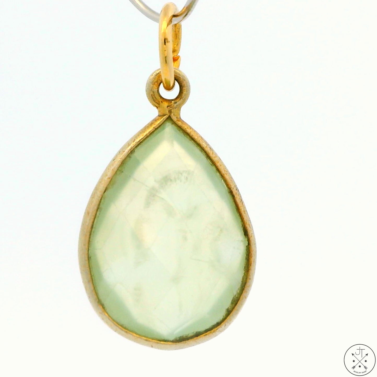 A gold-tone sterling silver bezel-set teardrop green quartz pendant.