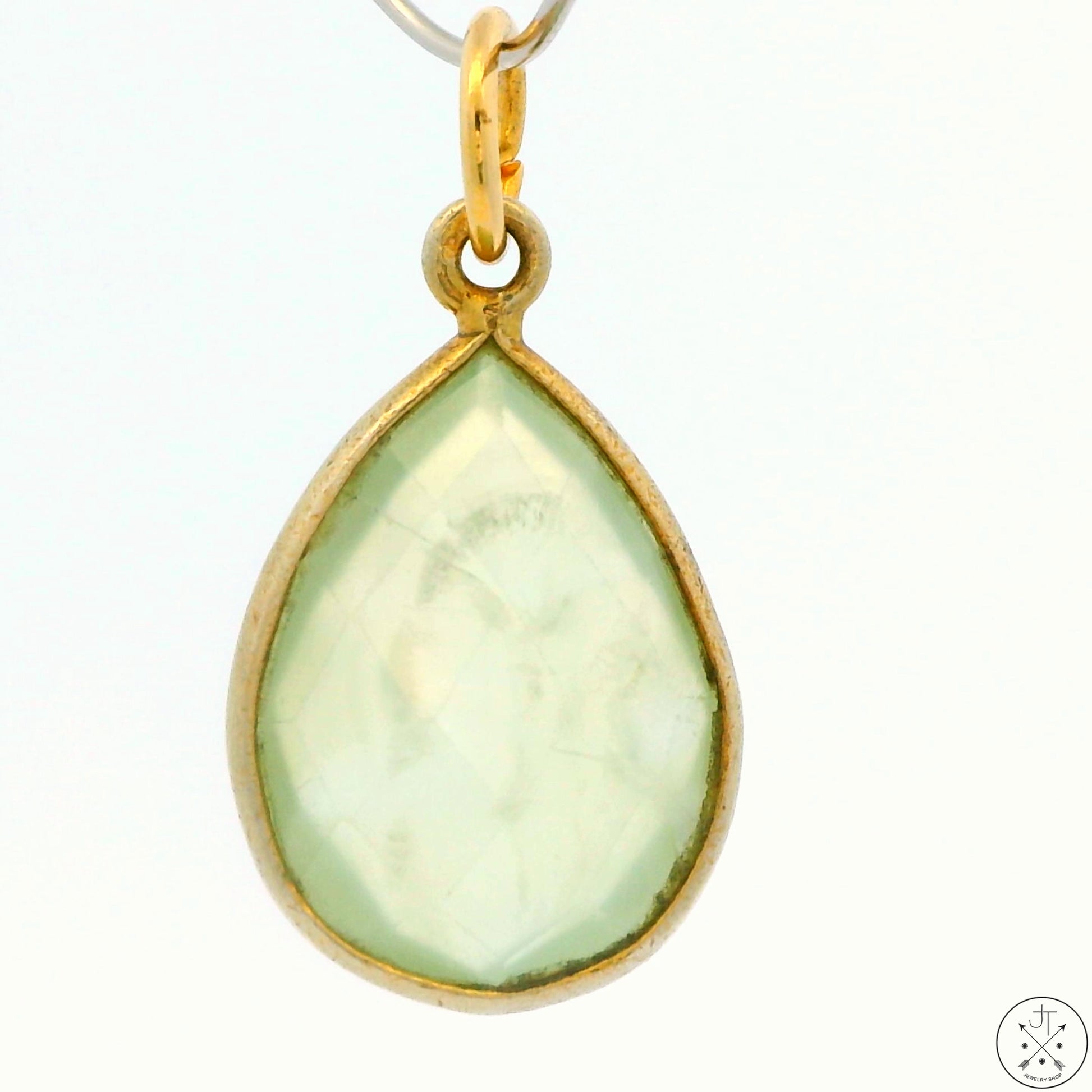 A gold-tone sterling silver bezel-set teardrop green quartz pendant.