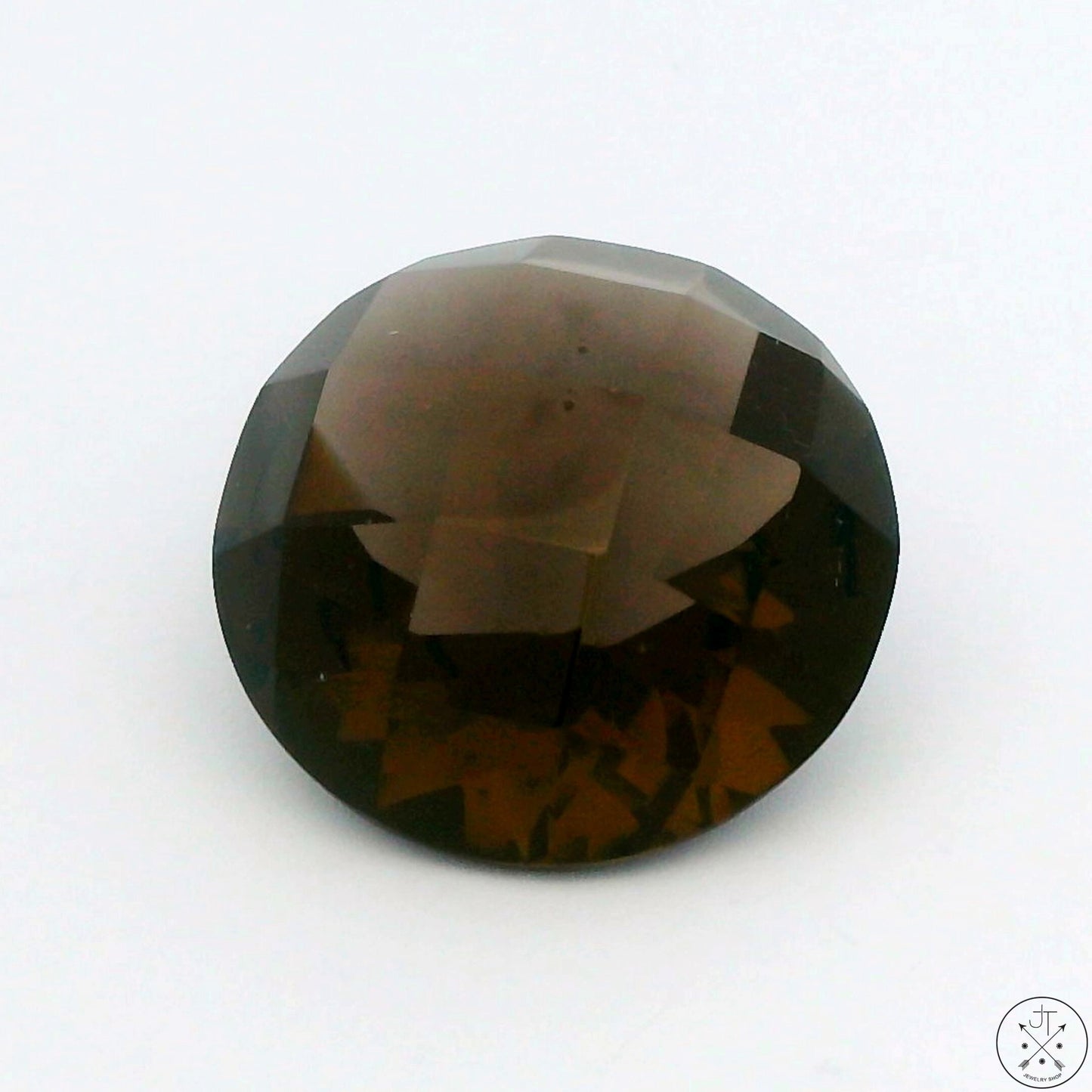 A round faceted natural smoky quartz gemstone.