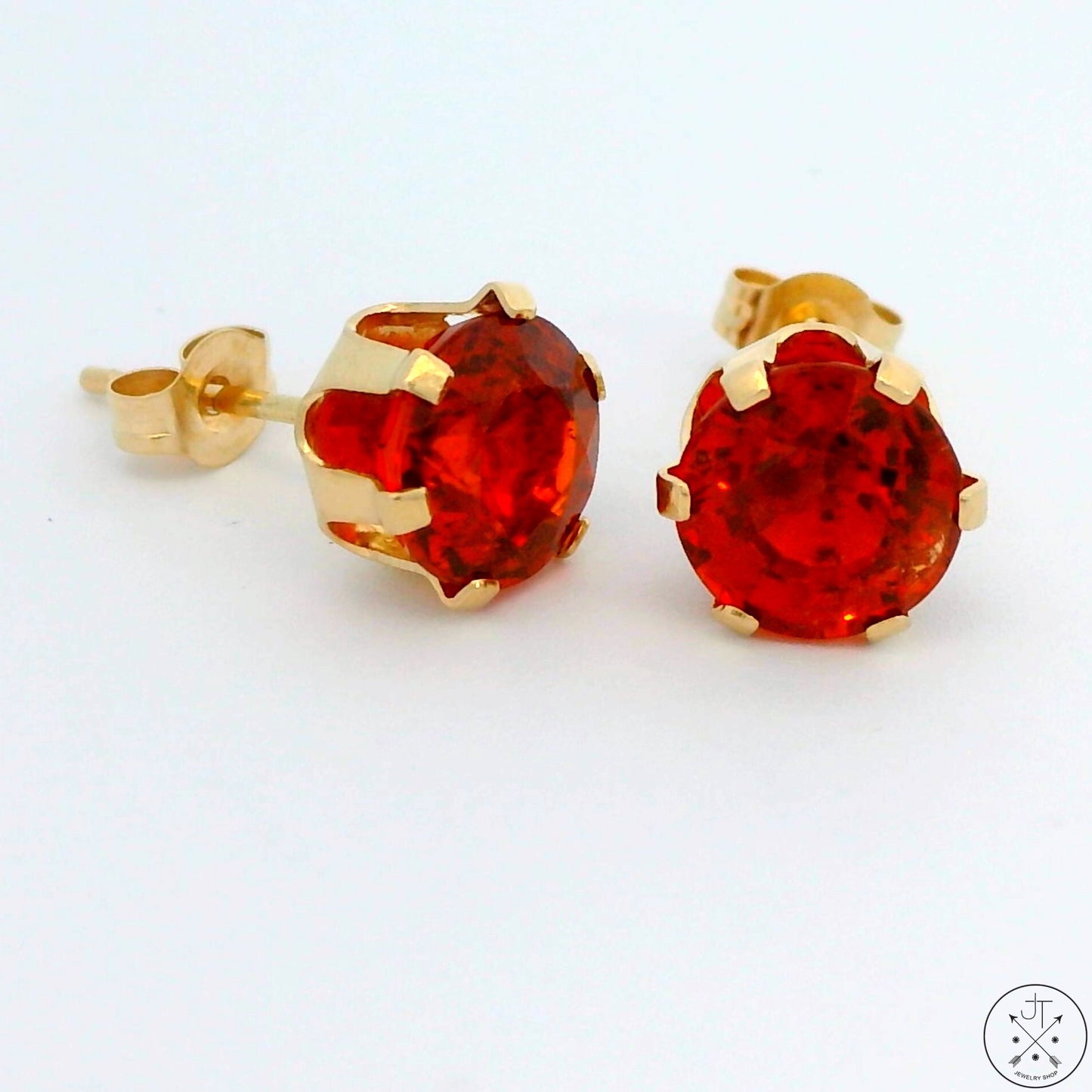 A pair of 14k yellow gold stud earrings with 2.7 ctw citrine 6.6 mm in diameter, with butterfly backs.