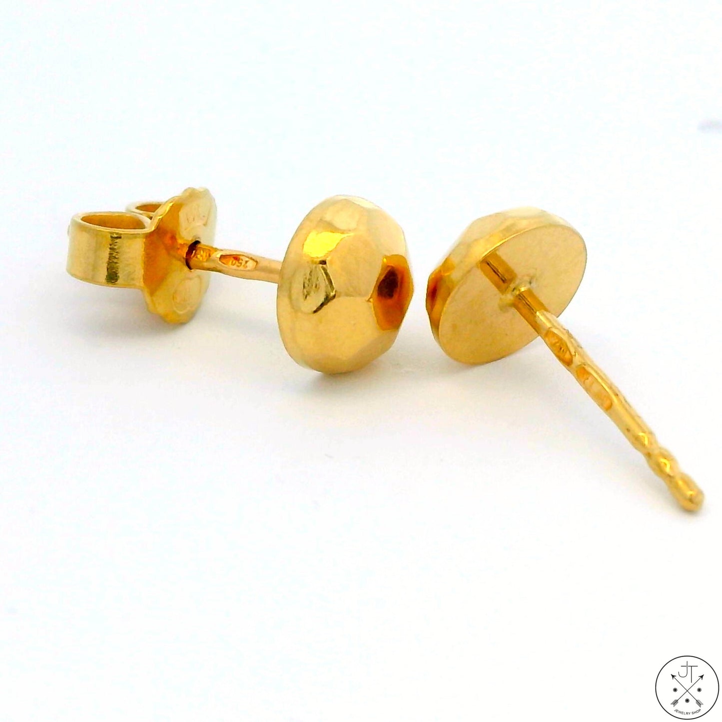 A pair of vintage 18k yellow gold stud earrings with geometric shaped backs.