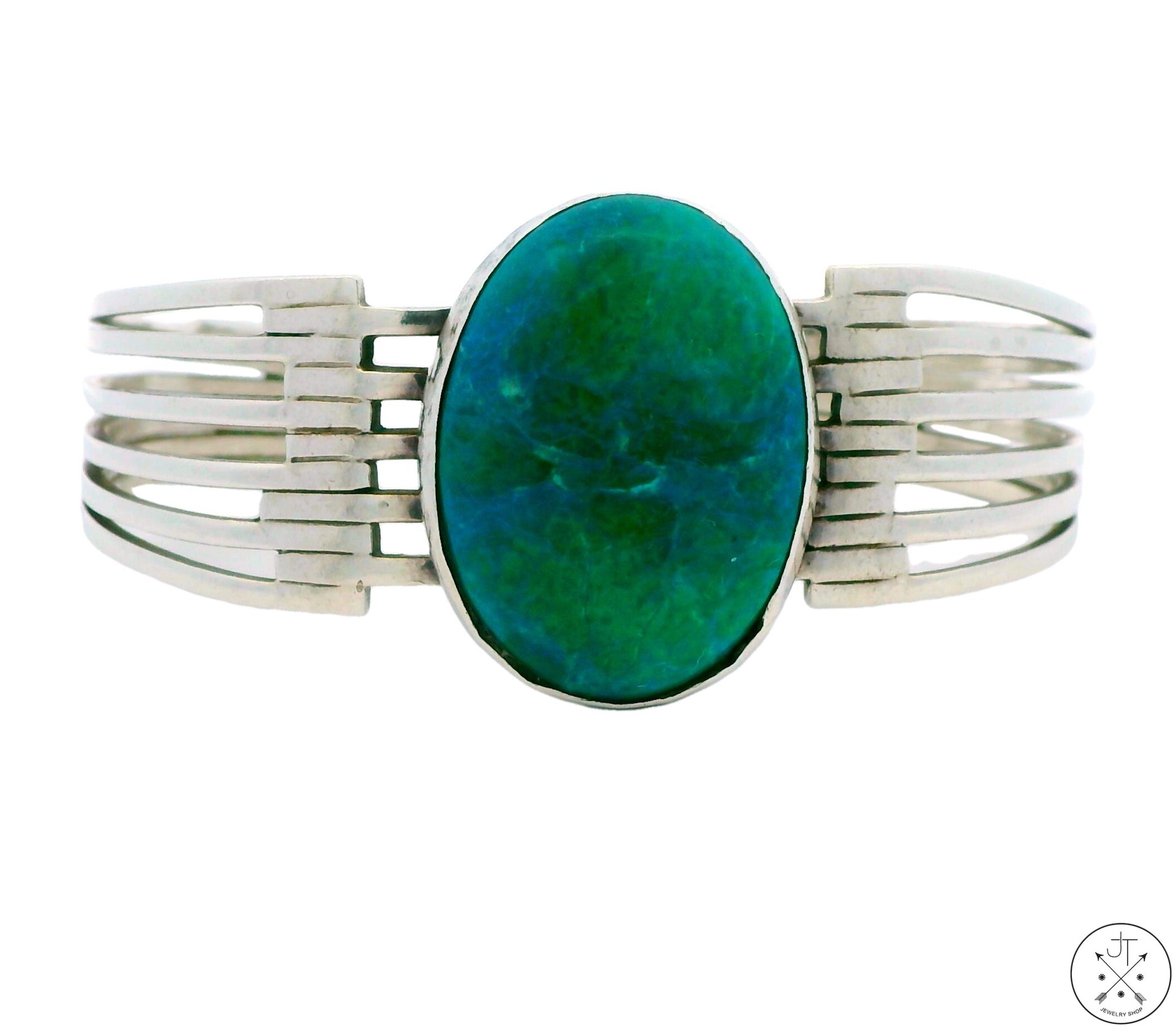 A vintage sterling silver cuff bracelet with a blue and green chrysocolla cabochon centerpiece, surrounded by a silver bracelet with stamped 'mexico 925 tp-112' on a white background.