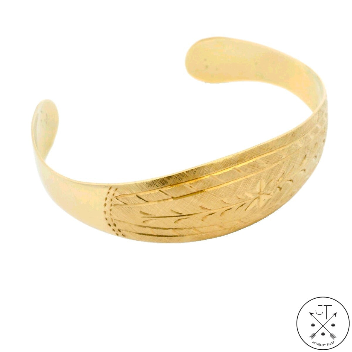 Vintage 14k Yellow Gold cuff bracelet with engraved design on a white background.
