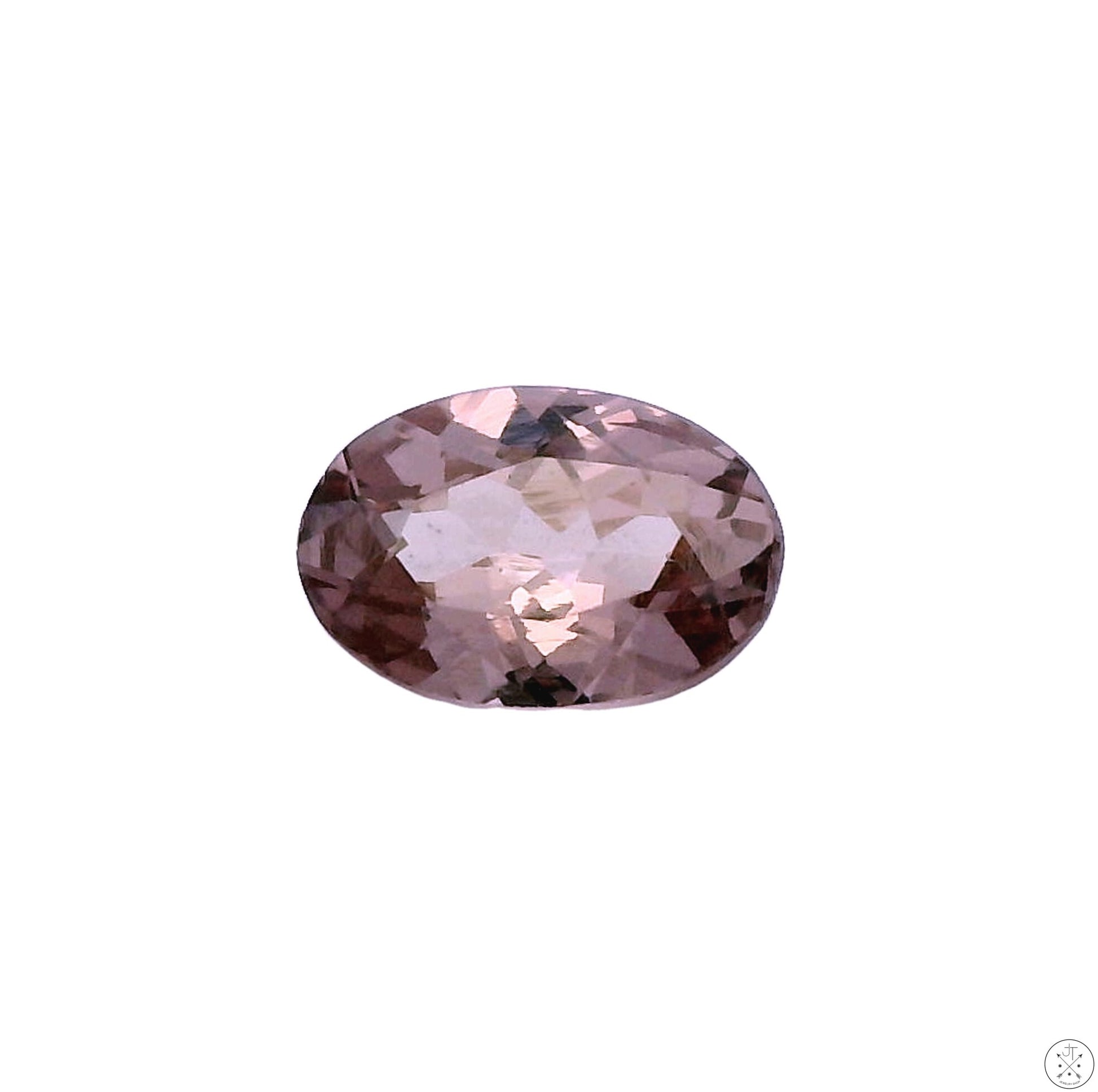 An oval faceted garnet gemstone with a color-change effect, displayed against a white background.