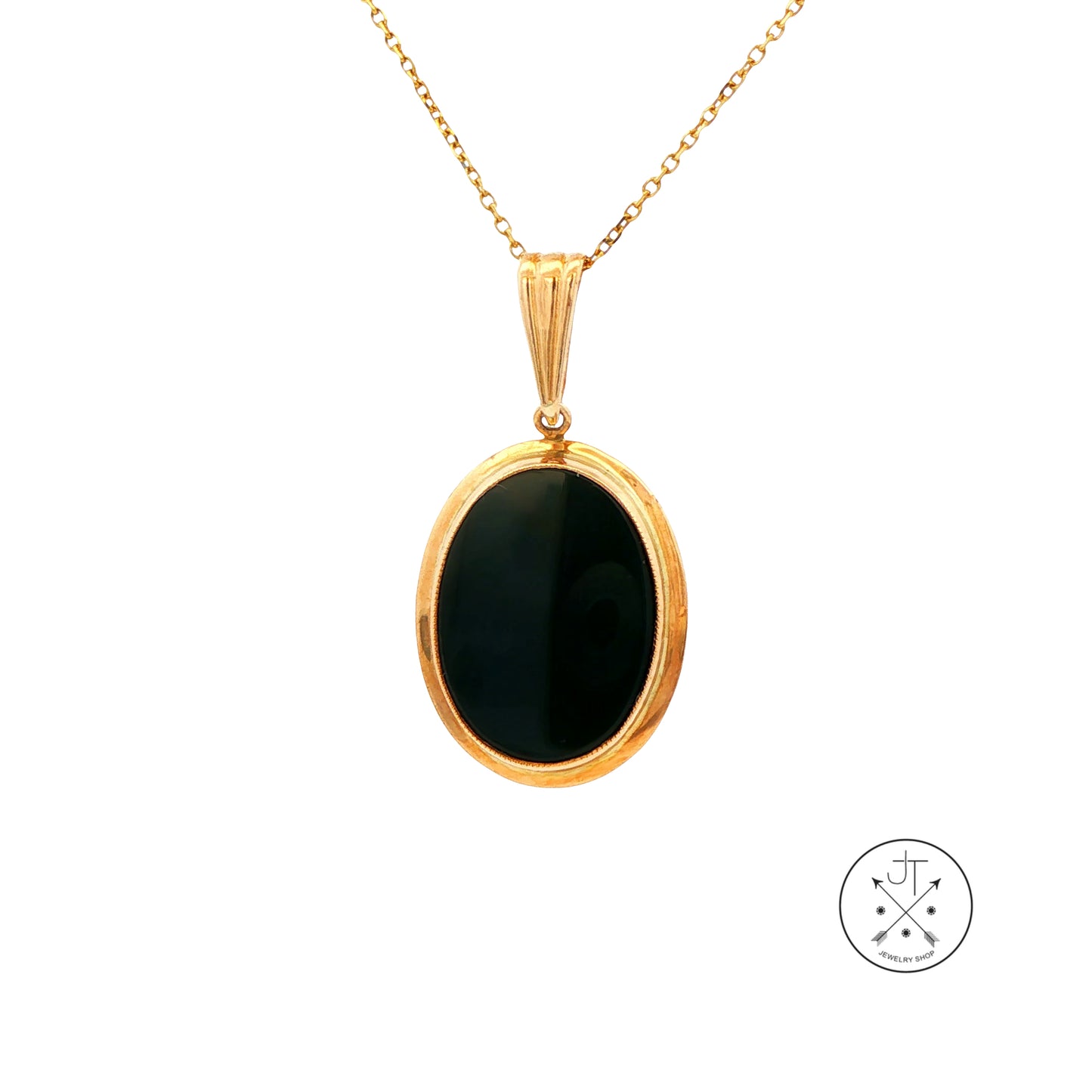 Gold pendant necklace with a black onyx stone on a white background