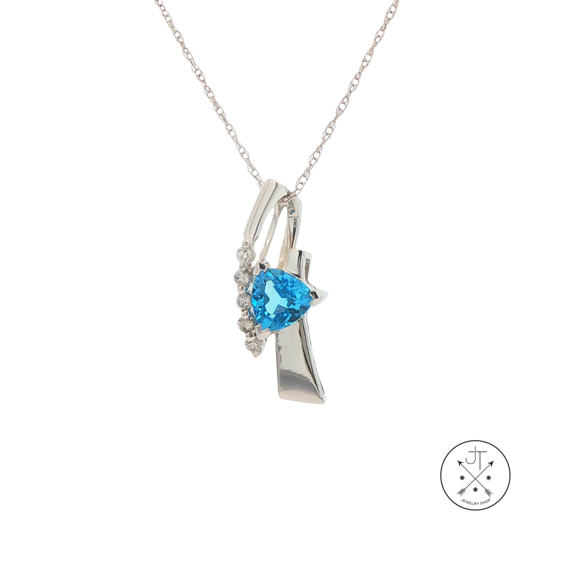 White Gold pendant necklace with blue topaz trillion.
