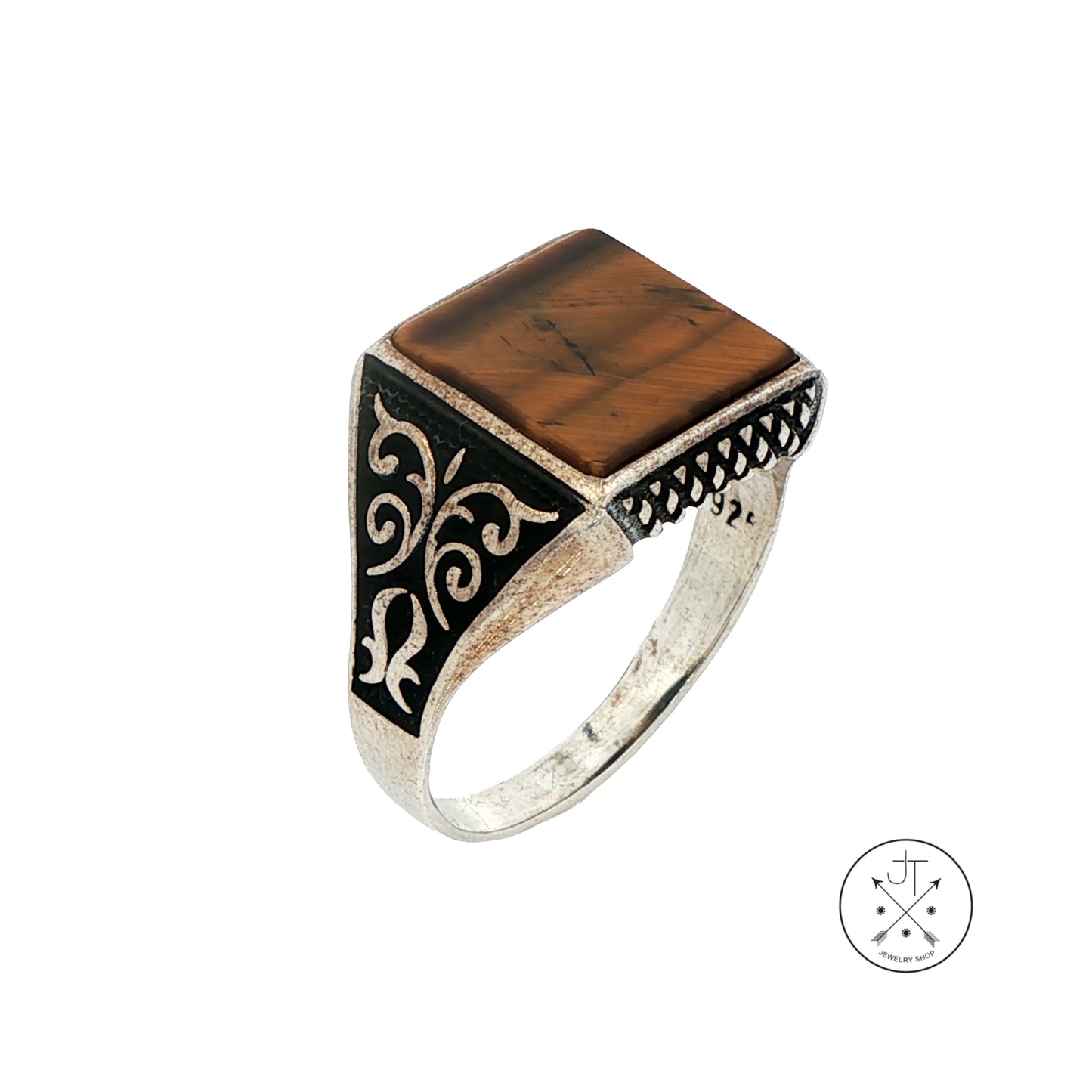 Silver ring with a brown square stone and intricate design on a white background