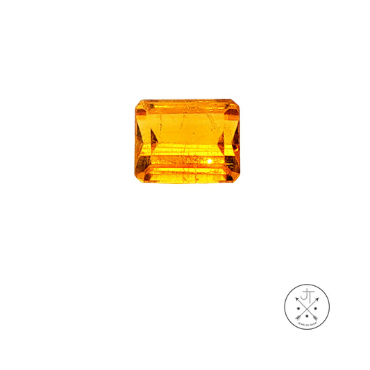 A rectangular yellow-orange heliodor beryl displayed on a clean white background with a small circular logo in the bottom right corner.