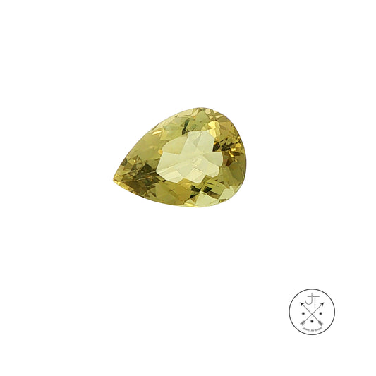 A single faceted pear-cut green beryl gemstone on a plain white background, with a small circular logo in the bottom-right corner.