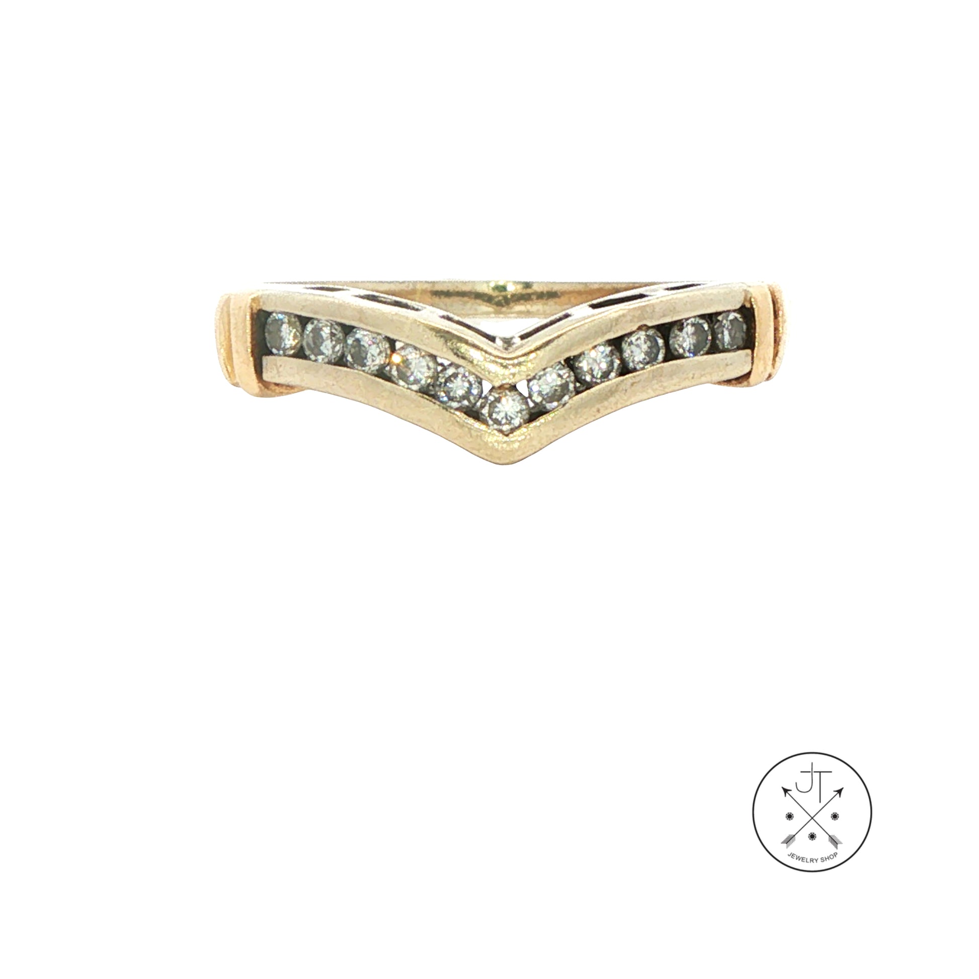 A vintage white gold ring with a chevron V-shaped design, featuring a row of small diamonds on the front. The ring is displayed on a clean white background with a circular logo in the bottom right corner.