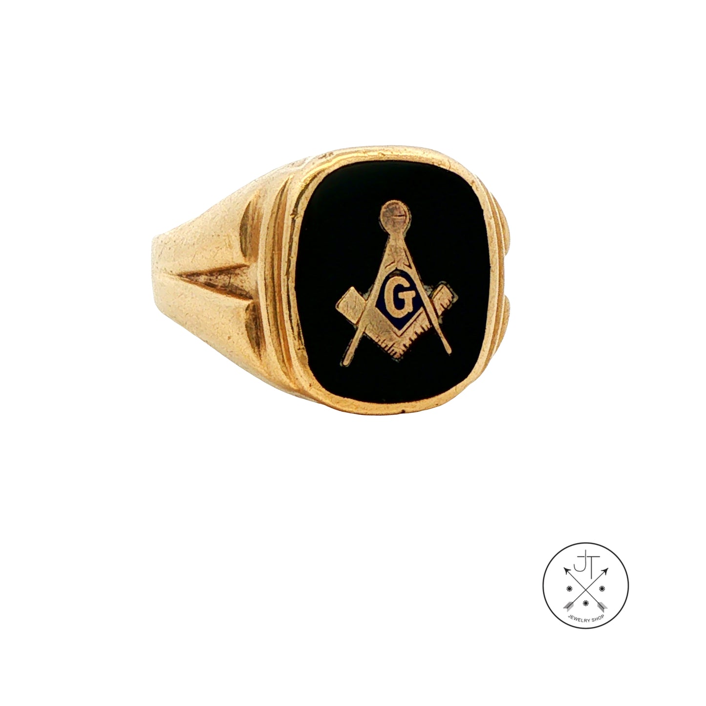 A gold signet ring featuring a black enamel face with a gold-tone Masonic square and compass emblem containing the letter G. The ring is photographed on a clean white background with a small circular logo watermark in the bottom right corner.