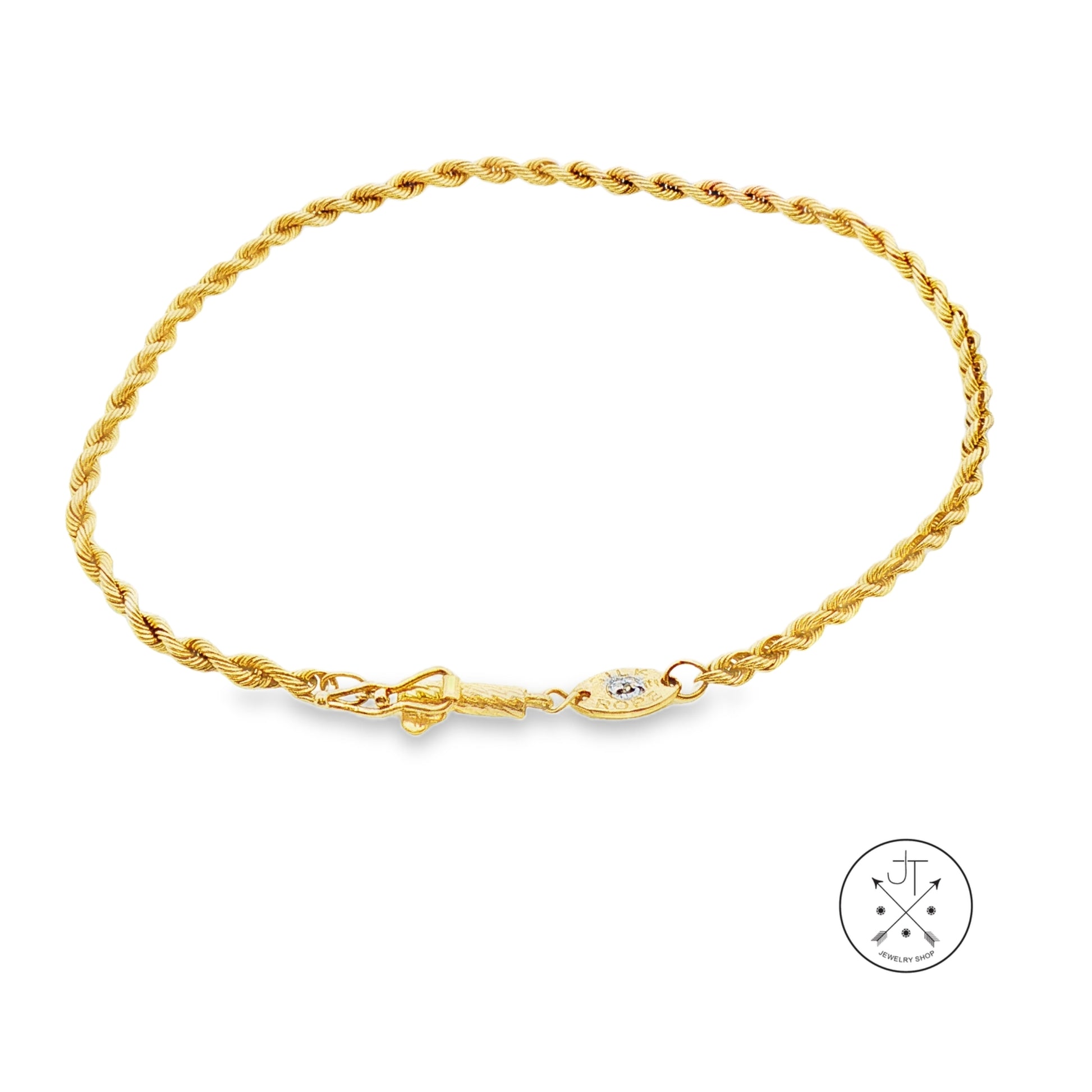A yellow gold rope chain bracelet with a lobster clasp and a small diamond charm, displayed on a clean white background with a brand logo in the bottom right corner.