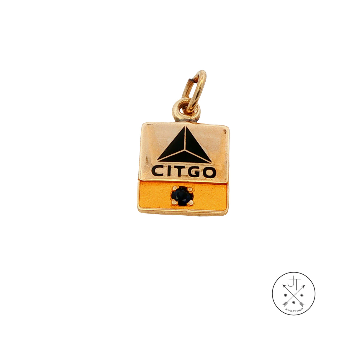 A Citgo flag-shaped pendant charm in 10k yellow gold with a black logo and a small dark blue gemstone, shown on a plain white background.