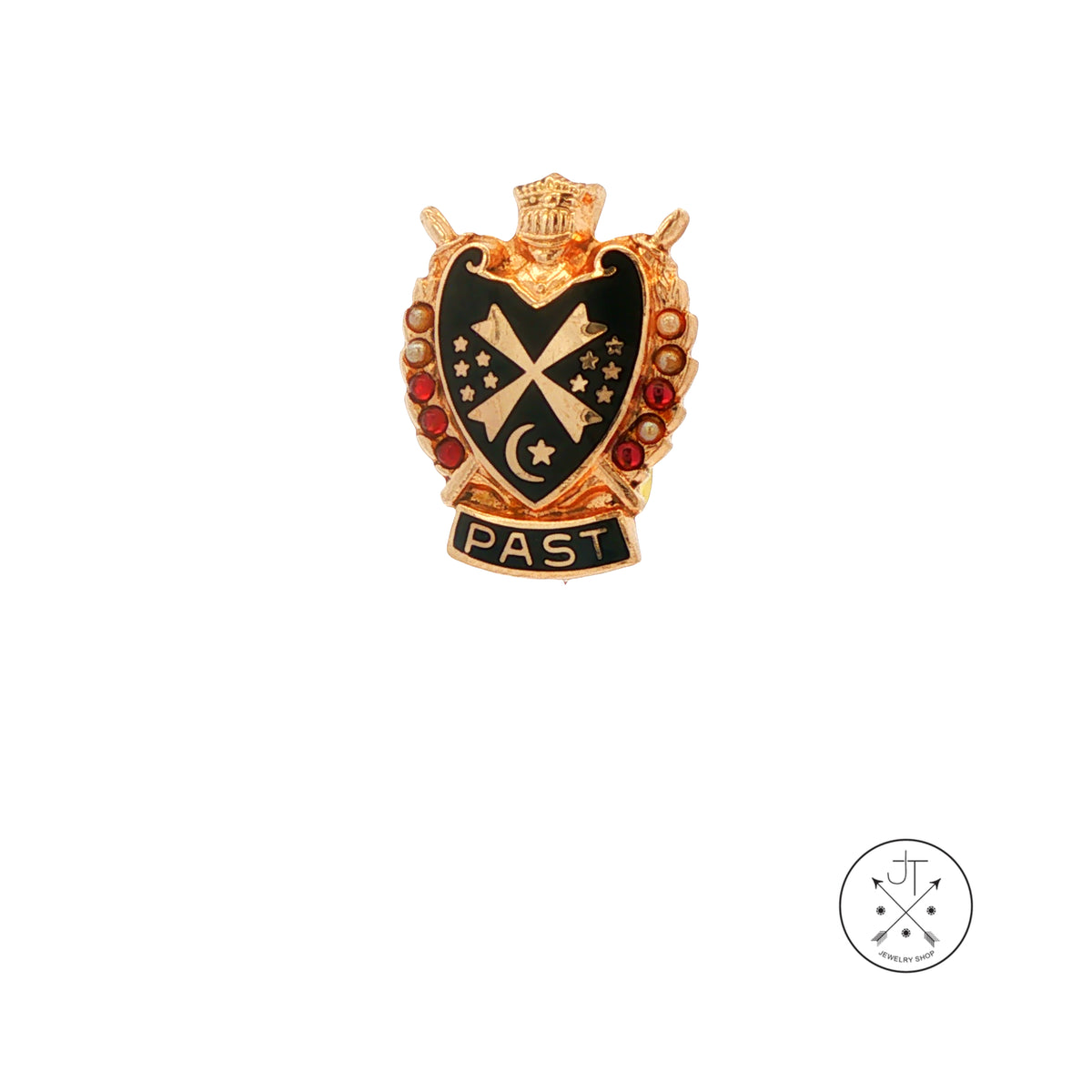 A 10k yellow gold crest pin with black enamel, red gem accents, and a banner reading 'PAST' at the bottom, shown on a plain white background with a small circular logo watermark in the lower right corner.