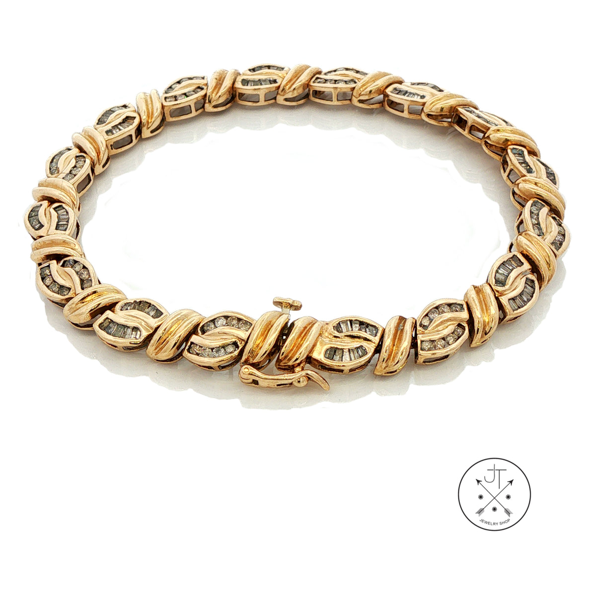 A 10k yellow gold tennis bracelet with alternating twisted oval links and diamond-set rectangular links, displayed on a clean white background with a small circular logo in the bottom right corner.
